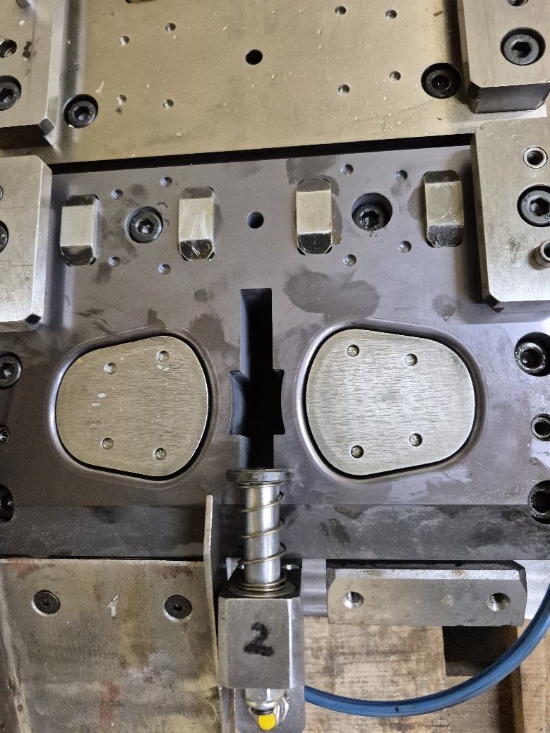 Formed sheet metal parts inside a stamping die